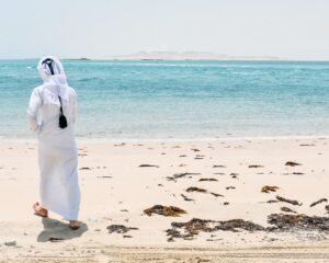 Middle Eastern Man by the beautiful water in the desert of Doha, Qatar