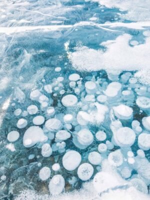 Ice bubbles at Abraham Lake, the famed methane bubbles that form when the ice freezes. Abraham Lake is one of the most beautiful lakes in the Canadian Rockies and an absolute must see!