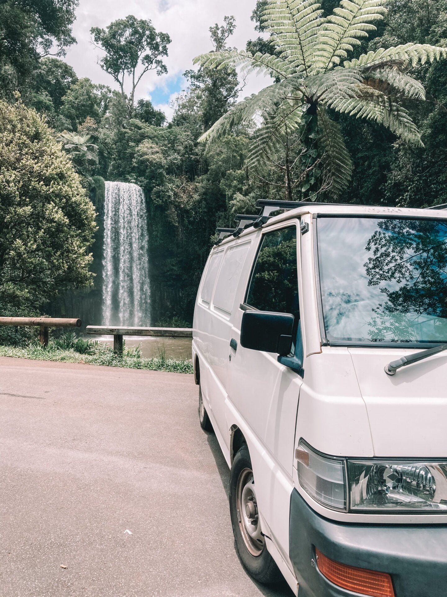 van parked near a waterfalls for Falling in and out of Van Life 