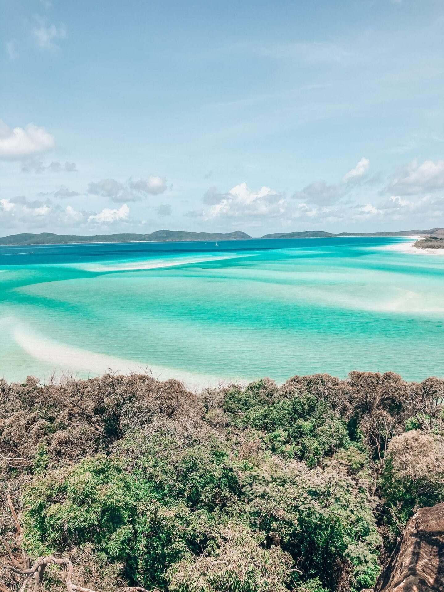 Whitehaven Beach in Airlie Beach, North Queensland while on my vanlife trip around Australia as a solo female traveller