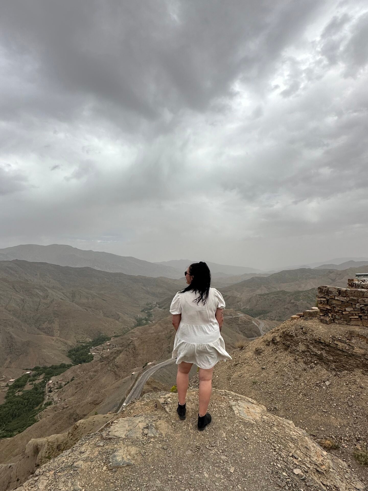 Taking in the captivating vista of Morocco, the landscape unfolds before me, a harmonious blend of mountains, valleys, and distant horizons. The scene captures the essence of exploration and appreciation for the diverse beauty of this North African gem.